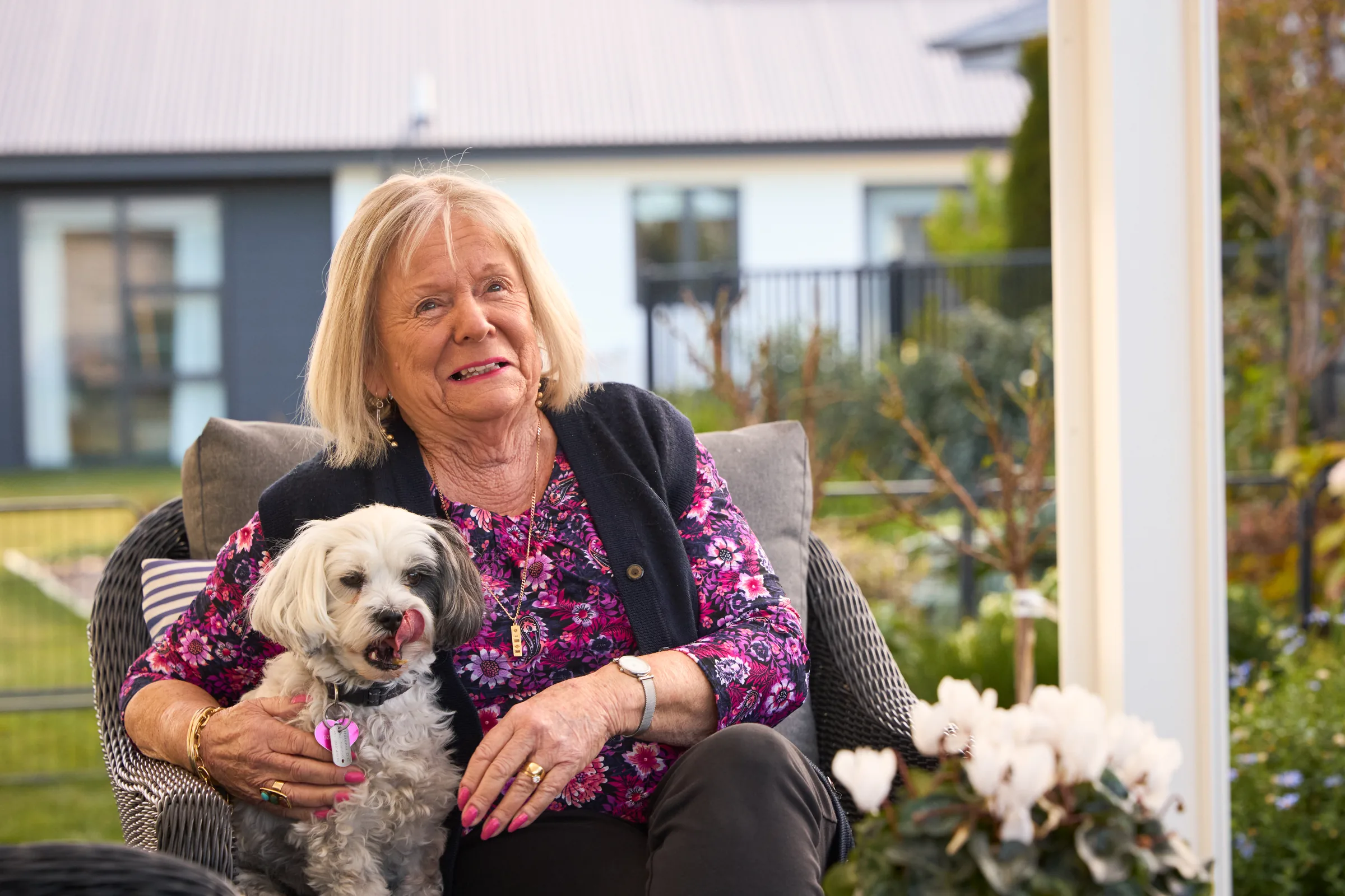 A resident outside with her dog.